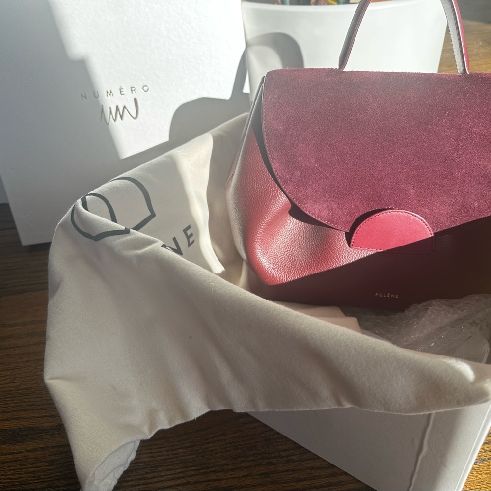 Large Polene Un Handbag in Burgundy.